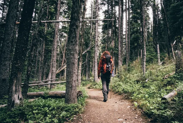 A woman hiking on a trail
